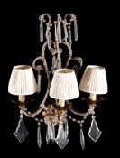 A pair of Continental, probably Italian gilt wrought iron and glass mounted...  A pair of