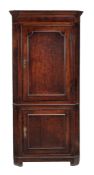 A George III oak and mahogany crossbanded standing corner cabinet, circa 1800  A George III oak