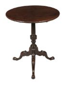 A George III mahogany tripod table circa 1790 with a circular top with...  A George III mahogany