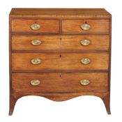 A George III mahogany chest of drawers circa 1790 the crossbanded top above...  A George III