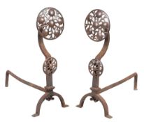 A pair of wrought iron andirons in Arts and Crafts style, early 20th century  A pair of wrought iron