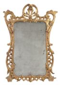 A carved and giltwood framed wall mirror in George III style, 19th century  A carved and giltwood