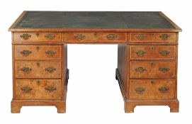 A walnut and featherbanded pedestal partners desk  A walnut and featherbanded pedestal partners desk