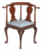 A George II mahogany corner chair circa 1740 with a shaped toprail on...  A George II mahogany