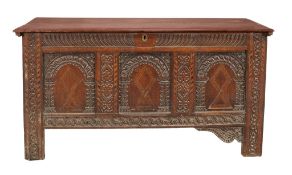 A Charles II oak and inlaid coffer circa 1680 with a moulded twin plank top...  A Charles II oak and