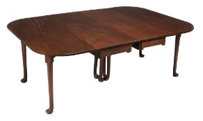 A George II mahogany extending dining table, circa 1750  A George II mahogany extending dining