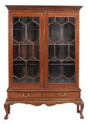 A mahogany display cabinet on stand 18th century and later elements the...  A mahogany display