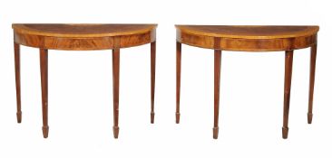 A pair of mahogany, rosewood and tulipwood semi eliptical tables in George...  A pair of mahogany,