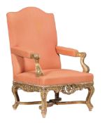 A carved giltwood and upholstered armchair in early 18th century style  A carved giltwood and