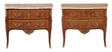 A pair of French tulipwood parquetry gilt metal mounted commodes in Louis XV...  A pair of French