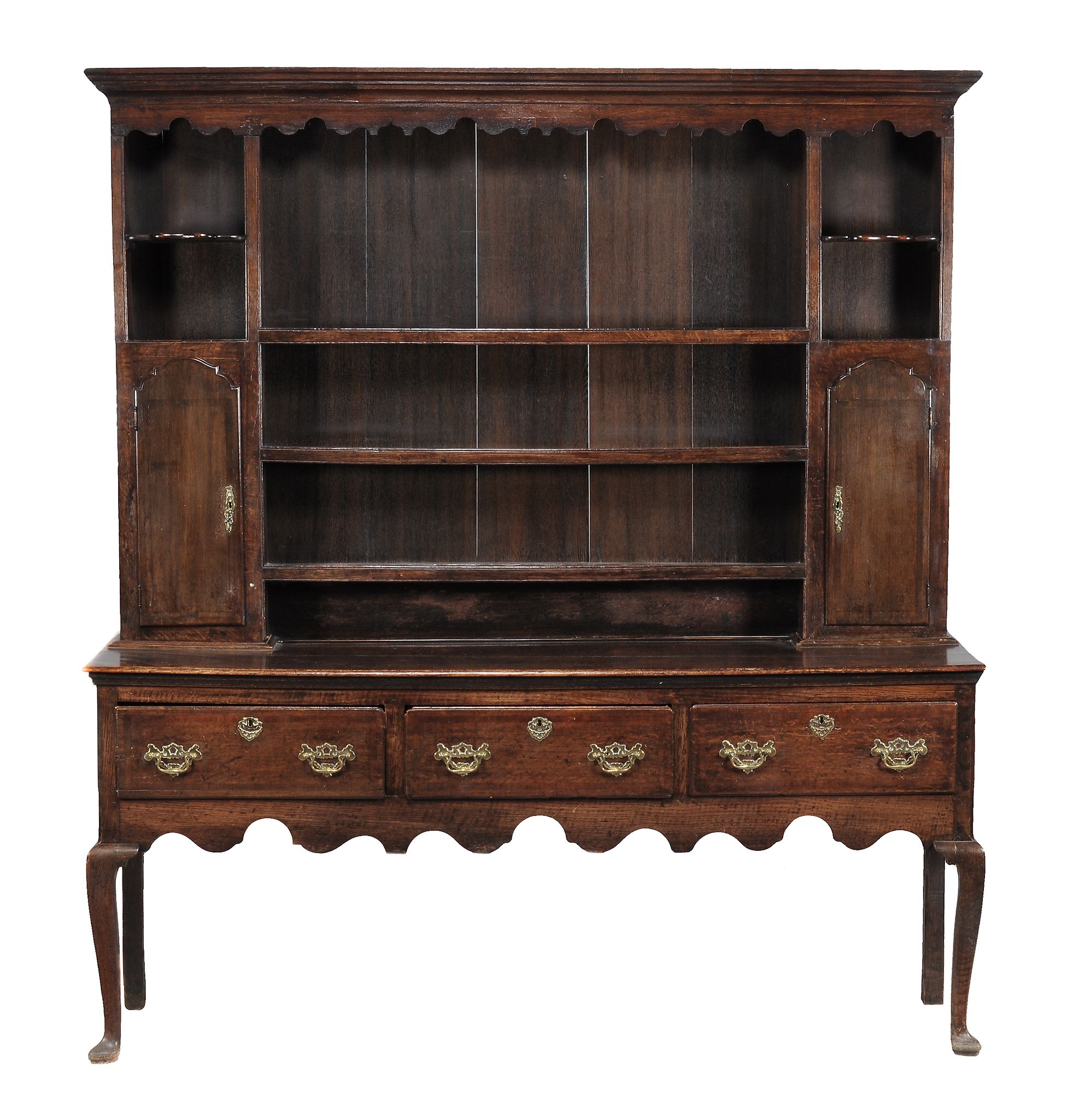 A George III oak dresser, circa 1780, the moulded cornice above an...  A George III oak dresser,