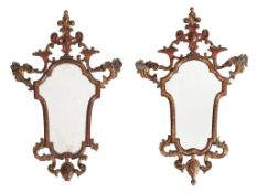 A pair of Continental carved giltwood wall mirrors , mid 18th century style  A pair of Continental