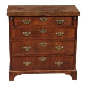 A George II walnut bachelor`s chest, circa 1740 , with herringbone stringing  A George II walnut