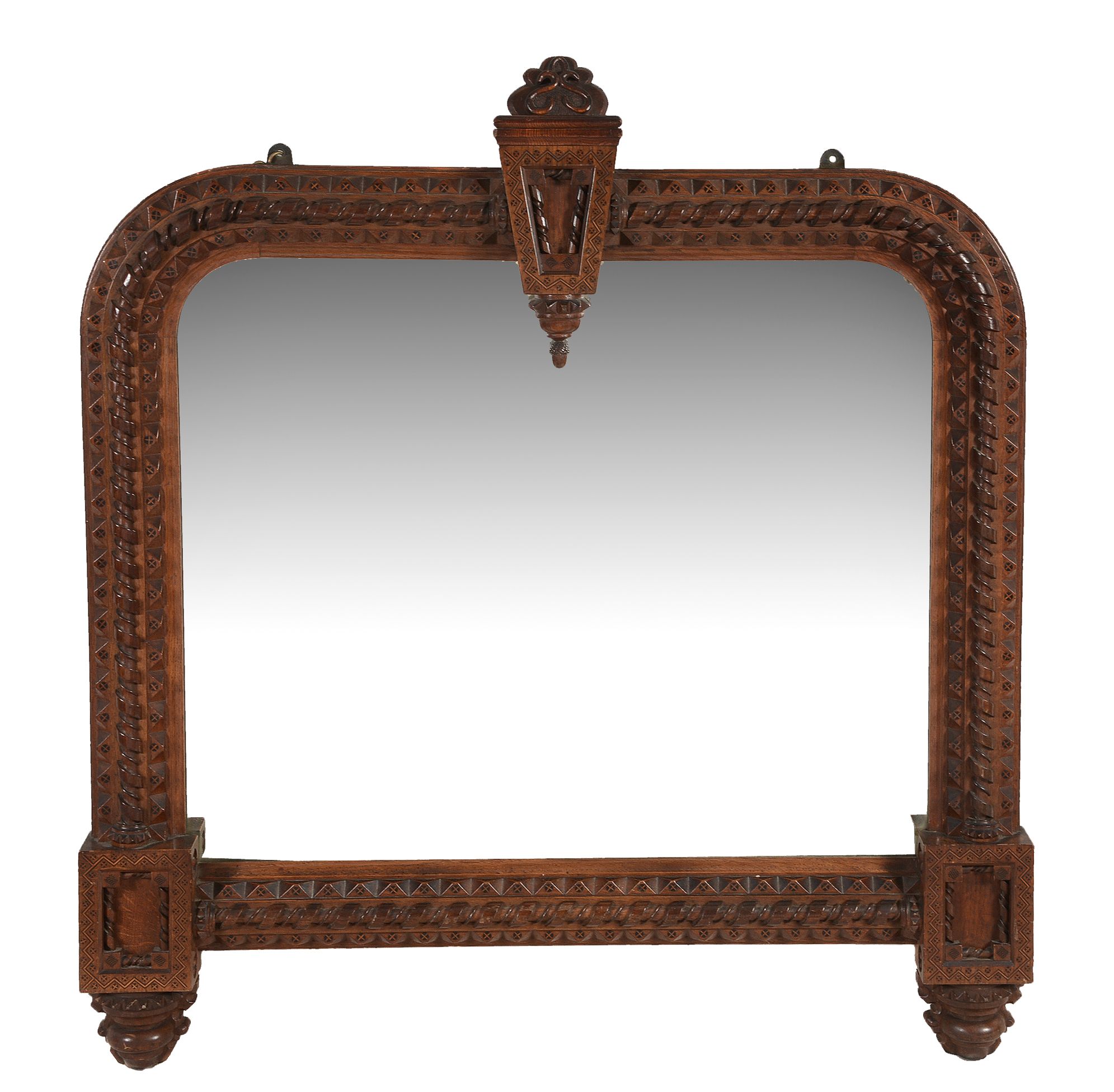 A carved oak and parquetry decorated wall mirror, circa 1860, possibly American  A carved oak and