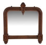 A carved oak and parquetry decorated wall mirror, circa 1860, possibly American  A carved oak and