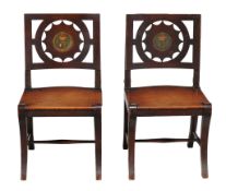 A pair of George III mahogany hall chairs, circa 1800  A pair of George III mahogany hall