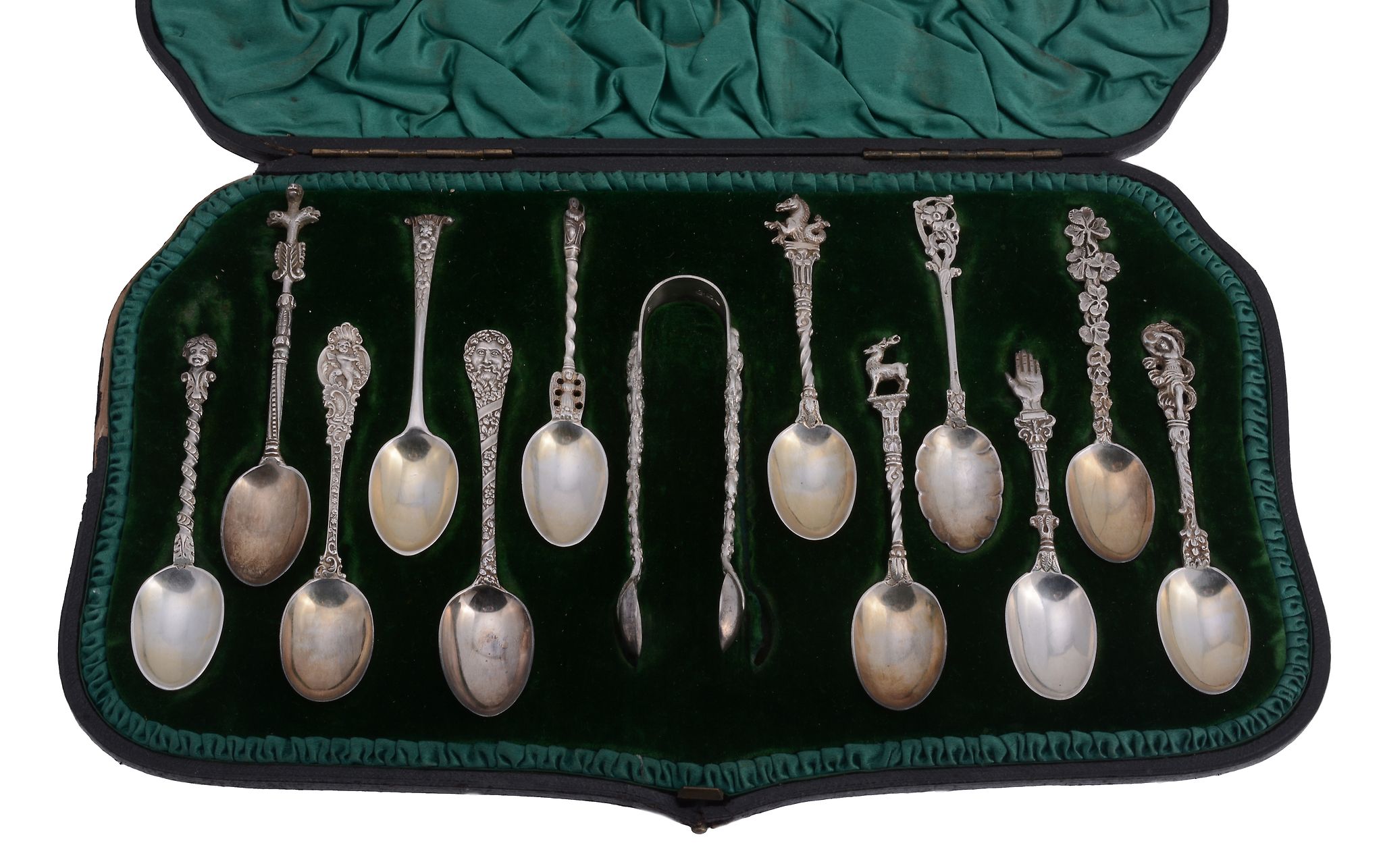 An unusual cased set of twelve Victorian silver tea spoons and a pair of... An unusual cased set