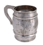 A silver barrel shaped mug by Goldsmiths & Silversmiths Co. Ltd A silver barrel shaped mug by