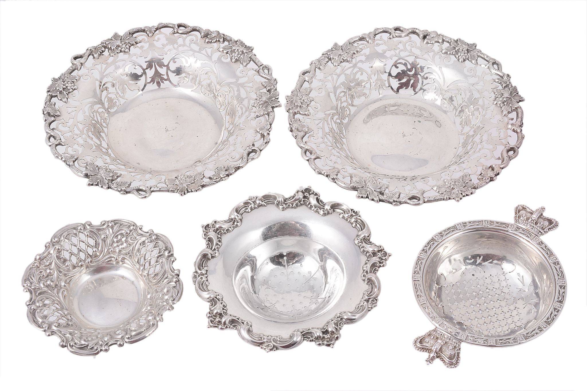 A pair of Irish silver shaped circular sweetmeat dishes by West & Son A pair of Irish silver