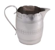 A barrel shaped cream jug by Vander & Hedges, London 1938, with a scroll handle A barrel shaped