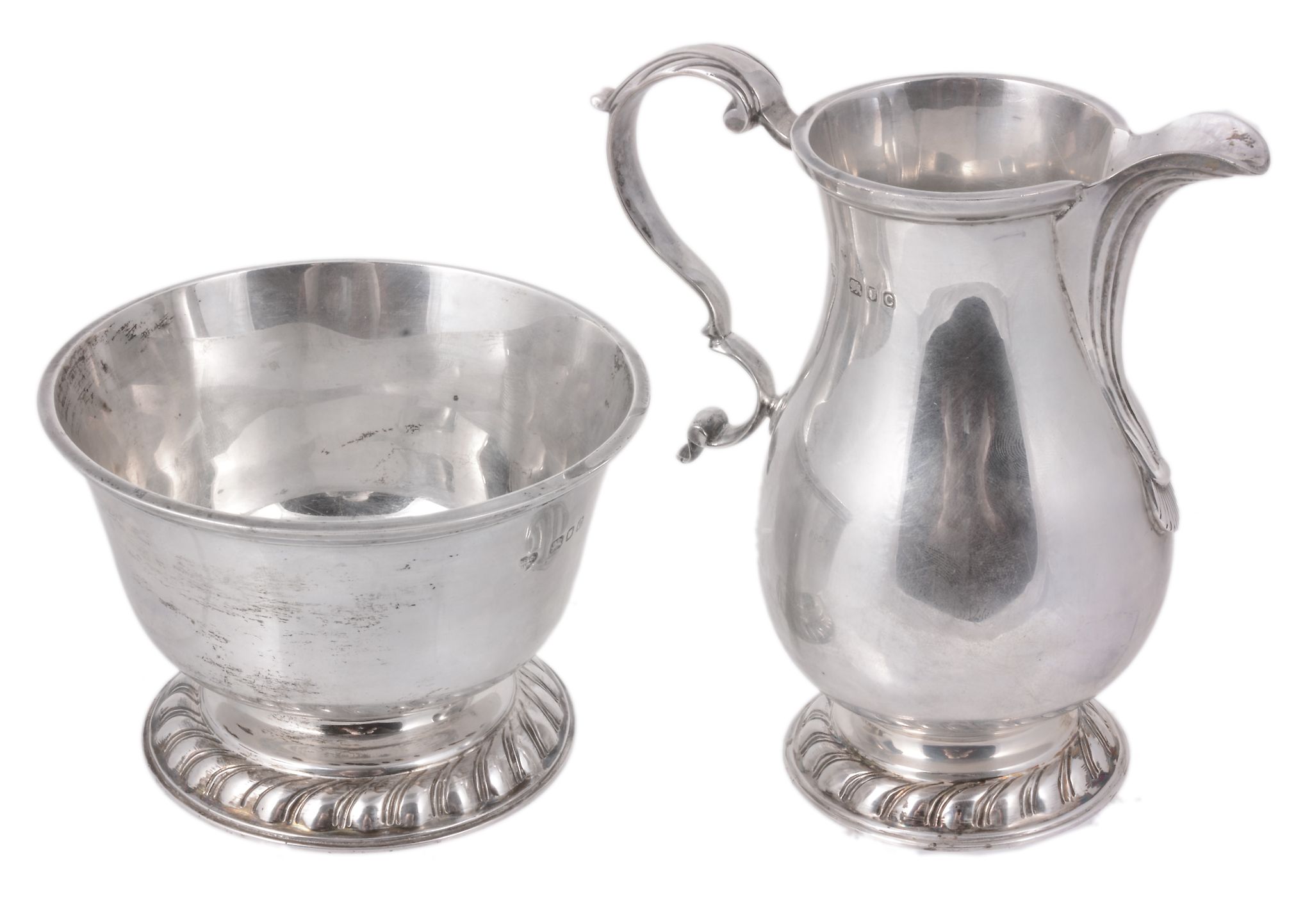 A silver baluster jug and a matching bowl by Goldsmiths & Silversmiths Co. Ltd A silver baluster jug