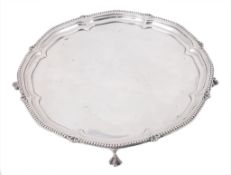 A shaped silver circular salver by Harrison Brothers & Howson, Sheffield 1917 A shaped silver