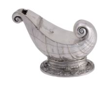 An electro-plated shell shaped spoon warmer by Atkin Brothers, on an oval foot An electro-plated