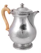 A late George III silver baluster jug by Robert Garrard, London 1817 A late George III silver