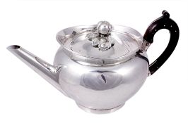 A Victorian silver cape pattern tea pot by Daniel & Charles Houle, London 1869 A Victorian silver