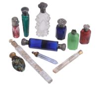 A collection of eleven silver mounted and other glass scent bottles A collection of eleven silver