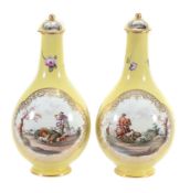 A pair of Dresden porcelain yellow-ground bottle vases and covers A pair of Dresden porcelain