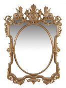 A Victorian gilt framed wall mirror last quarter 19th Century surmounted by... A Victorian gilt