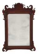 A medal cabinet in the form of a George II style wall mirror A medal cabinet in the form of a