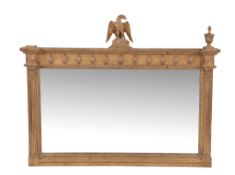 A carved giltwood wall mirror in Regency style, 20th century A carved giltwood wall mirror in