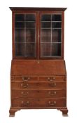 A George III mahogany bureau bookcase, circa 1770 A George III mahogany bureau bookcase , circa