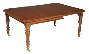A Victorian mahogany extending dining table, circa 1840 A Victorian mahogany extending dining