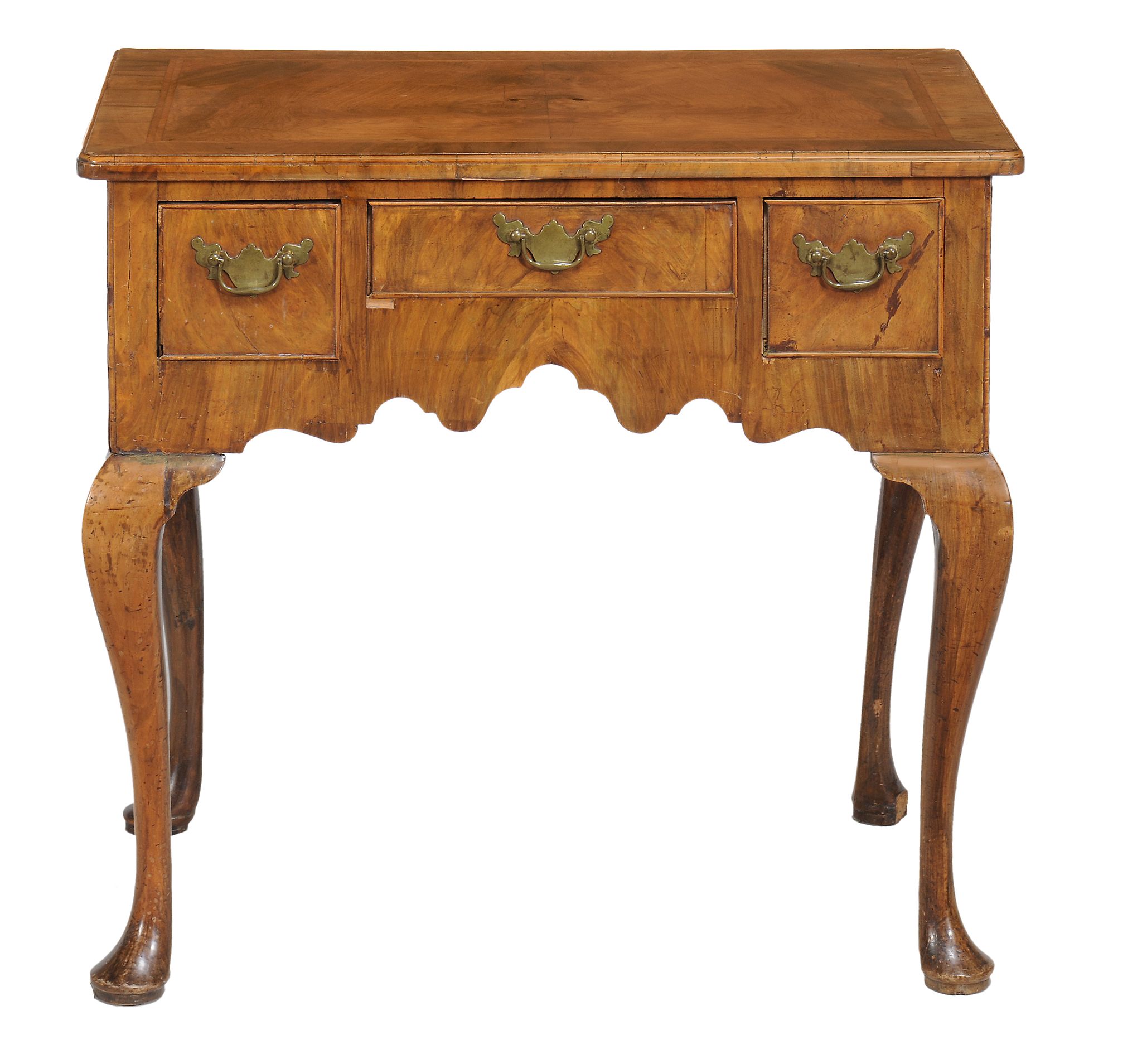 A George II walnut side table circa 1740 with a rectangular top with... A George II walnut side