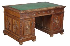 A Continental walnut pedestal desk, last quarter 19th century A Continental walnut pedestal desk,
