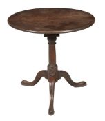 A George III mahogany tilt top tripod table circa 1780 with a circular top... A George III mahogany