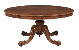 A Victorian burr walnut and walnut centre table circa 1870 the oval top with... A Victorian burr
