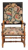 A Continental walnut and oak armchair, 18th Century with later elements with... A Continental