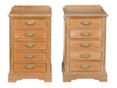 A pair of hardwood bedside chests 20th Century each with five drawers... A pair of hardwood bedside