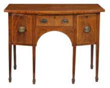 A George III mahogany and kingwood banded bowfront sideboard circa 1780 with... A George III