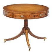 A mahogany and inlaid drum libarry table in George III style, 20th century A mahogany and inlaid