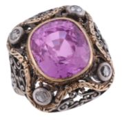 A synthetic pink sapphire and diamond dress ring  A synthetic pink sapphire and diamond dress