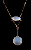 An early 20th century moonstone and garnet necklace, circa 1910  An early 20th century moonstone and