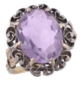 A 19th century amethyst ring, the central oval shaped amethyst within an...  A 19th century amethyst