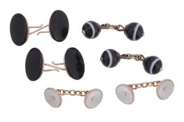A pair of onyx cufflinks , the oval onyx panels with hooked bar attachments;...  A pair of onyx