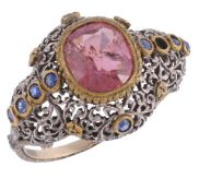 A pink tourmaline and sapphire dress ring  A pink tourmaline and sapphire dress ring,   the shaped
