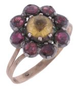 A 19th century garnet and yellow paste ring  A 19th century garnet and yellow paste ring,   the